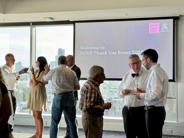 Guests chatting with each other in Woodward South Room over drinks and canapes
