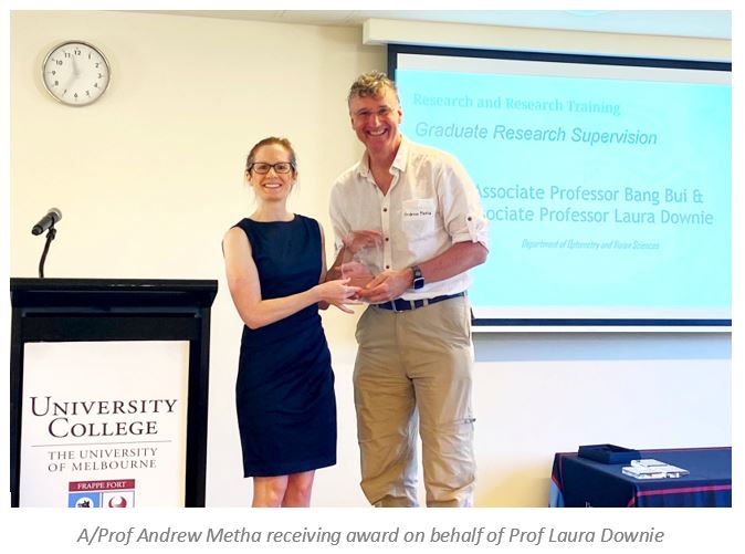 Photograph of A/Prof Andrew Metha receiving award on behalf of Laura Downie