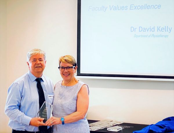 Photograph of Dr David Kelley receiving award