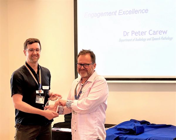 Photograph of Peter Carew receiving award