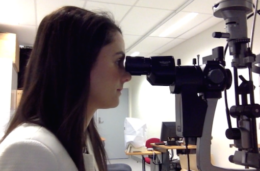 Associate Professor Laura Downie pictured viewing slit lamp