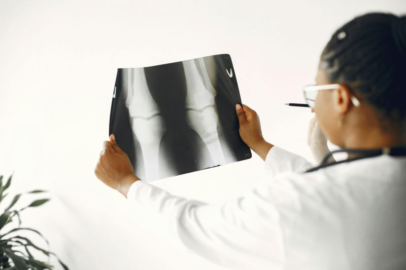 Clinician holding knee xrays