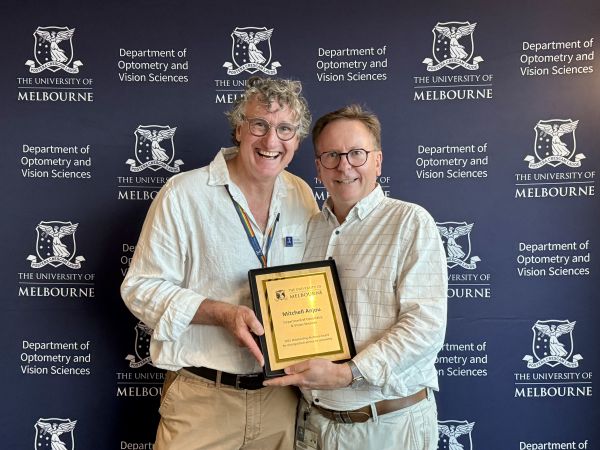 Andrew presenting the DOVS Alumnus award to Mitchell
