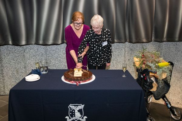 Photo of Sanchia and Judith cutting cake